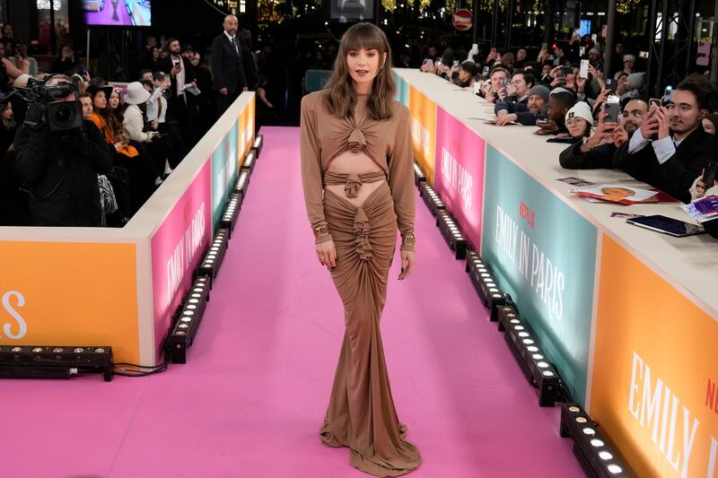 Lily Collins on the pink carpet. AP Photo