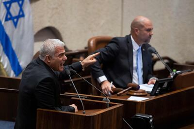 Opposition leader and former prime minister Yair Lapid, left, speaks during a reading on controversial government judicial reforms. AFP