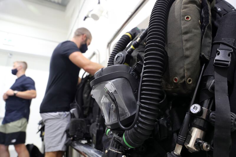 Royal Navy ship divers try out the new Deep Dive Dubai pool.