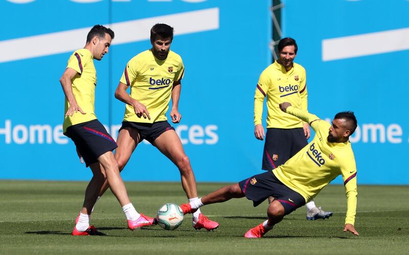 Sergio Busquets, Gerard Pique, Lionel Messi and Arturo Vidal during a training session at Ciutat Esportiva Joan Gamper. Getty Images