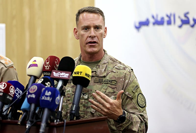U.S. Army Colonel Ryan Dillon, spokesman for Operation Inherent Resolve (OIR), the U.S.-led coalition against the Islamic State group, speaks during a press conference in Baghdad, Iraq, Thursday, Aug. 24, 2017. Dillon said ISIS is "completely surrounded" in the town of Tal Afar and "are being killed." (AP Photo/Karim Kadim)