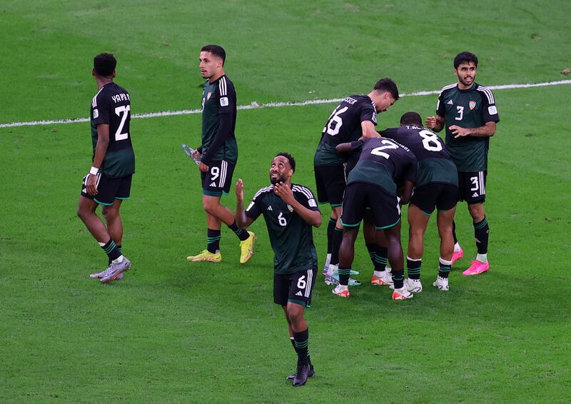 The UAE team celebrate Khalifa Al Hammadi's equaliser. Reuters