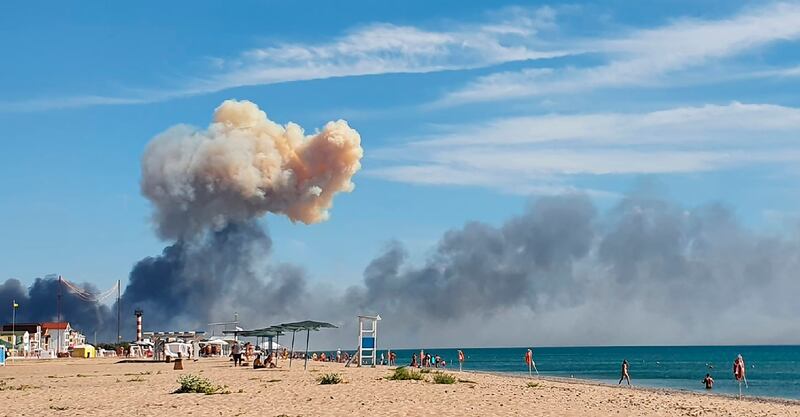 Plumes of smoke billow in the direction of Saki air base near Novofedorivka, Crimea. AP