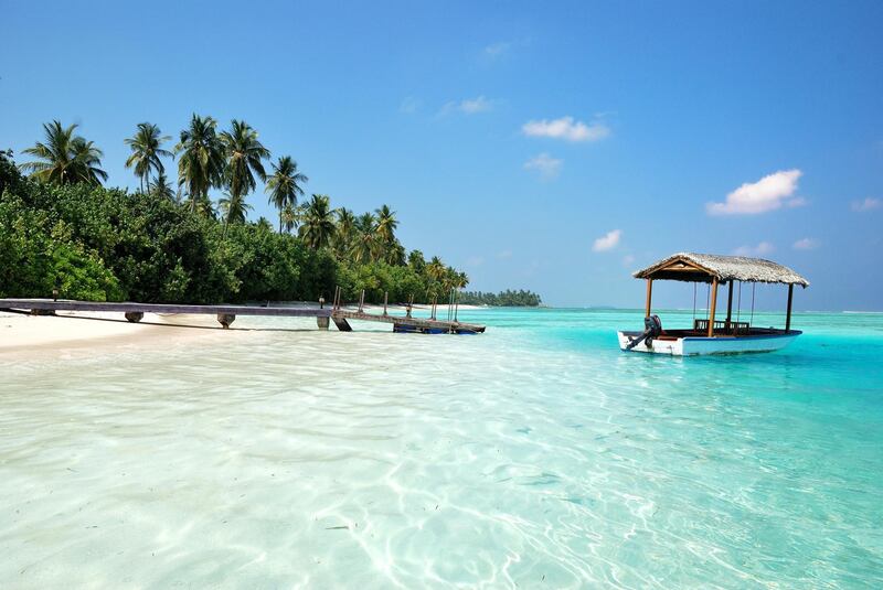 Etihad will resume its flights to Male, Maldives in July. Pictured, Medhufushi Island Resort. Unsplash / Colin Watts