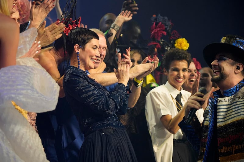 Christina Cordula, centre, celebrates onstage after walking the runway at the Jean Paul Gaultier show. Getty