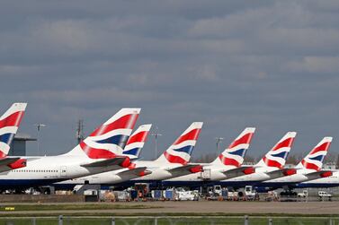 Tailfins of British Airways aircraft grounded at Heathrow Airport terminal 5 during the pandemic. Parent company IAG sold $1.4bn of new bonds and confirmed it is considering selling BA's Heathrow headquarters. AFP