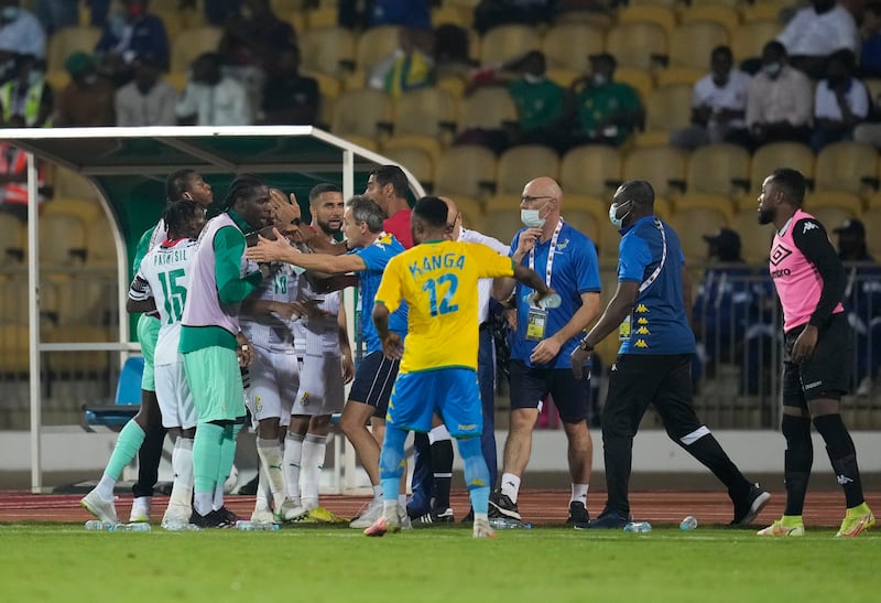 A scuffle breaks out after between Gabon and Ghana players and team official during the African Cup of Nations 2022 group C soccer match between Gabon and Ghana at the Ahmadou Ahidjo stadium in Yaounde, Cameroon, Friday, Jan.  14, 2022.  (AP Photo / Themba Hadebe)