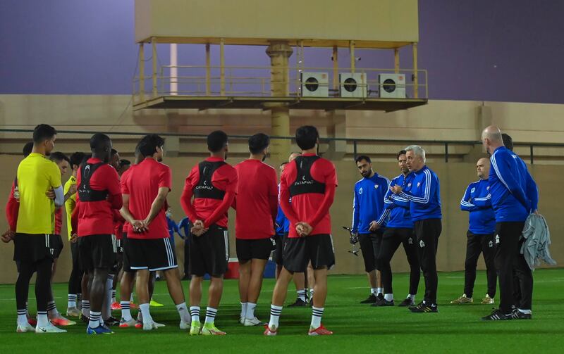 UAE manager Bert van Marwijk speaks to his players during the training session. Photo: UAE FA