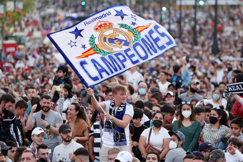 Real Madrid fans celebrate at Plaza de Cibeles following the club's La Liga title triumph. Getty