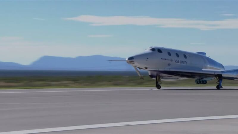 The VSS Unity spaceplane lands in a New Mexico desert after flying three paying passengers to the edge of space.