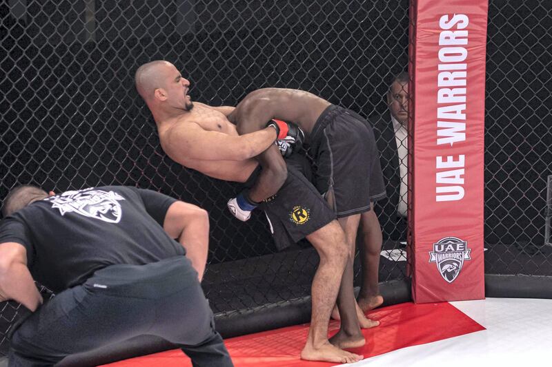 Emirati Ahmed Al Darmaki has Ugandan Kagimu Kigga in a standing guillotine choke position. Courtesy UAE Warriors