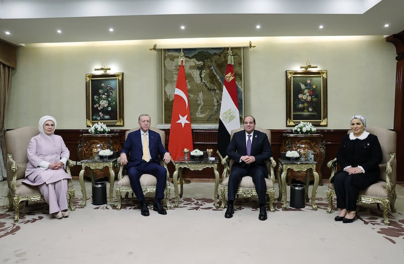 Mr El Sisi, centre right, his wife Entissar Amer, right, and Mr Erdogan, centre left, and his wife Emine Erdogan, left, during their meeting in Cairo. EPA
