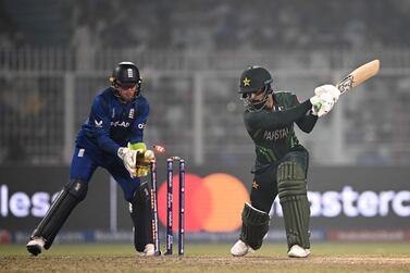 Pakistan's Shadab Khan (R) is clean bowled as England's wicketkeeper captain Jos Buttler watches during the 2023 ICC Men's Cricket World Cup one-day international (ODI) match between England and Pakistan at the Eden Gardens in Kolkata on November 11, 2023.  (Photo by DIBYANGSHU SARKAR  /  AFP)  /  -- IMAGE RESTRICTED TO EDITORIAL USE - STRICTLY NO COMMERCIAL USE --