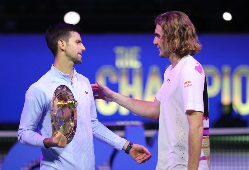 Novak Djokovic with Stefanos Tsitsipas after their match. Reuters