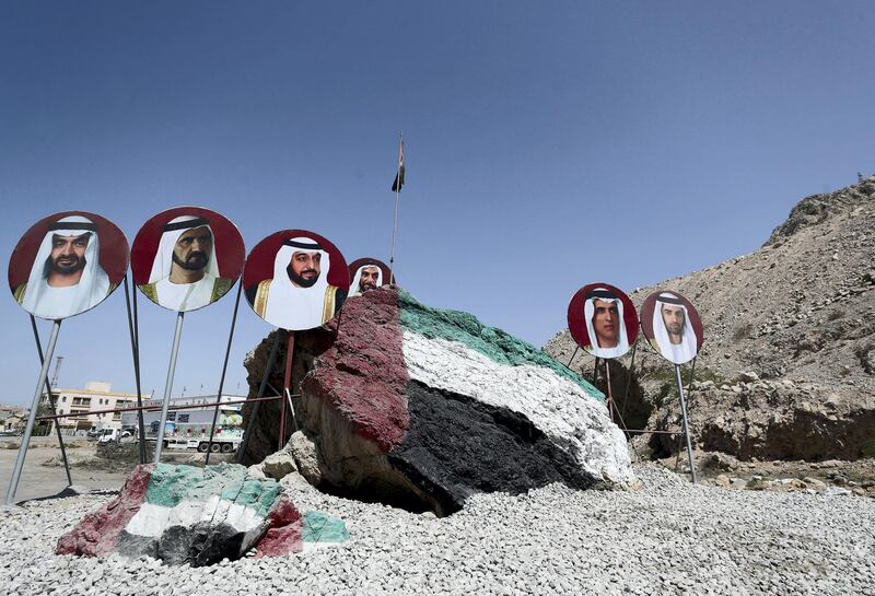 Ras Al Khamiah, United Arab Emirates - Reporter: N/A. Standalone. A massive rock is painted in the UAE flag with pictures of the royal family around it. Monday, March 22nd, 2021. Ras Al Khamiah. Chris Whiteoak / The National