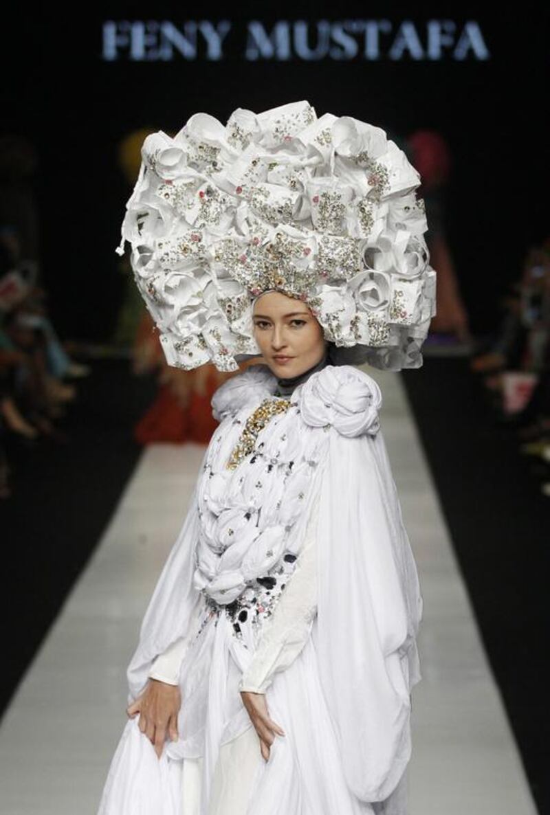 A model displays a creation by Indonesian designer Feny Mustafa during the Jakarta Fashion Week in Jakarta, Indonesia. Achmad Ibrahim / AP Photo