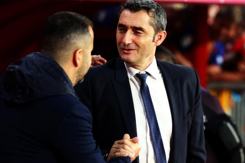Granada's head coach Diego Martinez greets Barcelona's head coach Ernesto Valverde. EPA