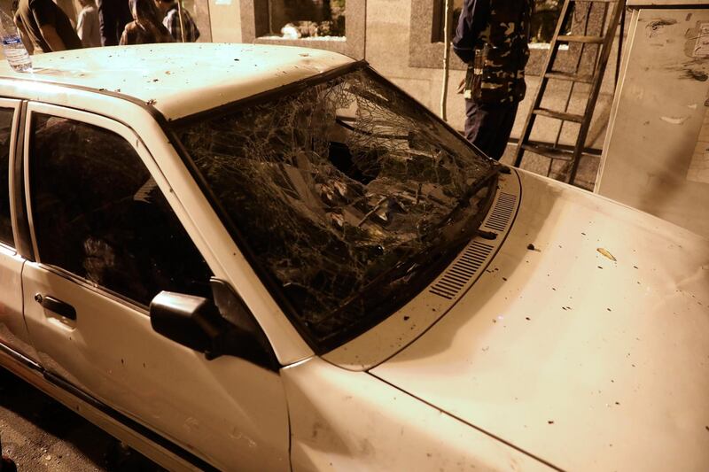 A car's windshield is shattered during the explosion. AP Photo