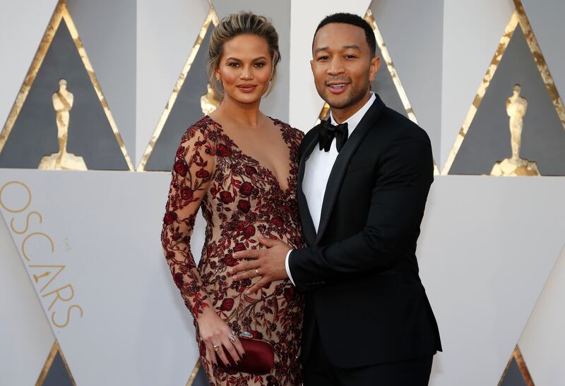 Teigen and John Legend arrive at the 88th Academy Awards in Hollywood, California, on February 28, 2016. Reuters