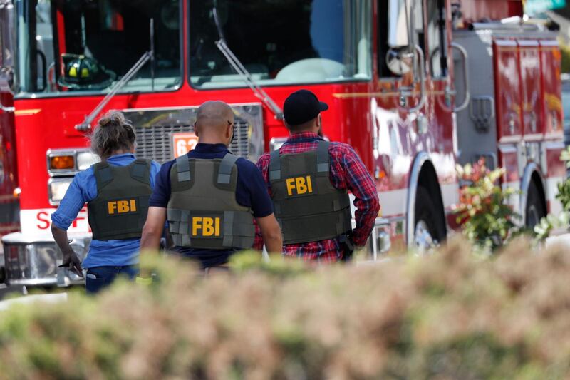 FBI agents arrive on the scene of the shooting. They will attempt to piece together the reason's behind the shooter's actions, which remain unexplained. EPA/JOHN G. MABANGLO