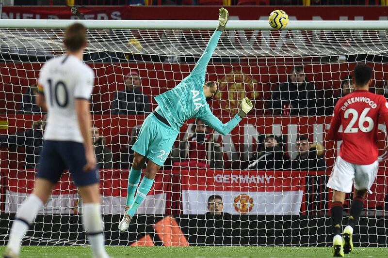 Tottenham goalkeeper Paulo Gazzaniga deflects the ball onto the bar. AFP