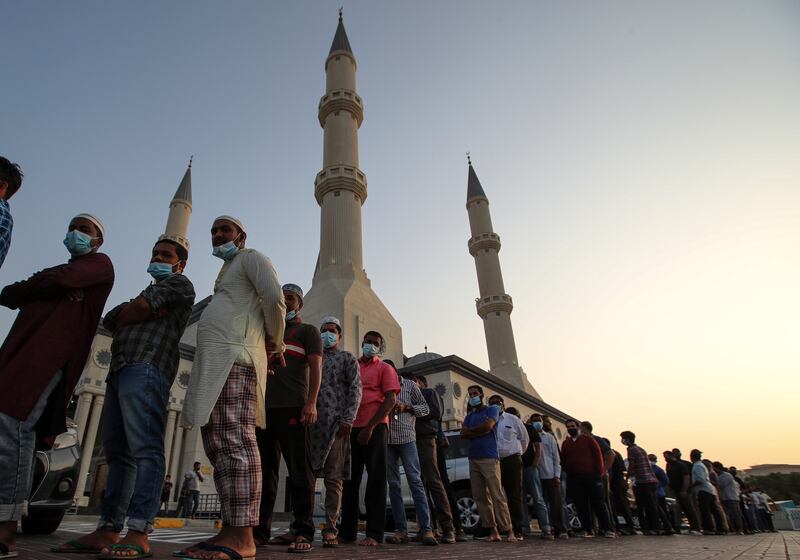 People queue outside Al Farooq Mosque in Dubai before sunset, waiting to break their fast. EPA