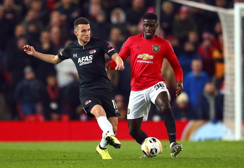 AZ Alkmaar's Oussama Idrissi, left, and Manchester United's Axel Tuanzebe vie for the ball at Old Trafford. AP