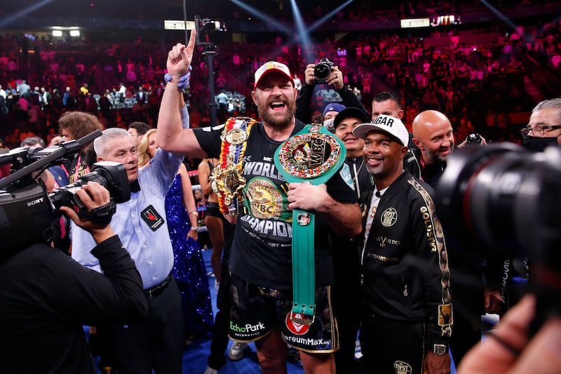Tyson Fury  celebrates after defeating Deontay Wilder to retain his title. AP