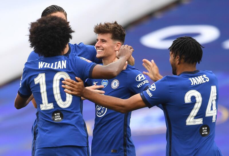 Chelsea's Mason Mount, centre, celebrates with team-mates scoring his side's second goal. EPA