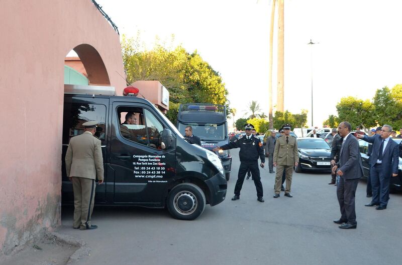 A picture taken on December 20, 2018, shows Moroccan police officers driving a truck carrying the bodies of the two murdered Scandinavian hikers as they are being transported from a morgue in the capital Marrakesh to the airport. The bodies of Danish student Louisa Vesterager Jespersen, 24, and 28-year-old Maren Ueland from Norway were found on December 17, after the two friends had pitched their tent at an isolated mountain site two hours' walk from the tourist village of Imlil. / AFP / -
