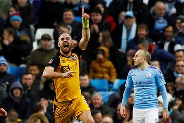 Port Vale's Tom Pope celebrates scoring their first goal as Manchester City's Angelino looks on. City would go on to winb the FA Cup third-round tie 4-1. Reuters