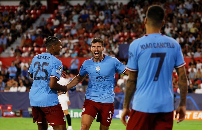 City's Ruben Dias celebrates scoring their fourth goal with Manuel Akanji. Reuters