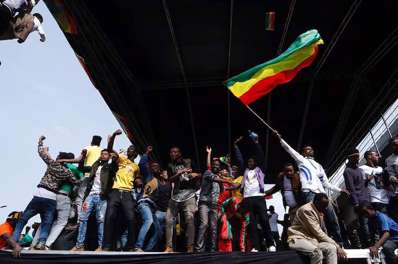 Ethiopians cheer on stage during a rally called by Prime Minister Abiy Ahmed, on Meskel Square in Addis Ababa. Yonas Tadese / AFP