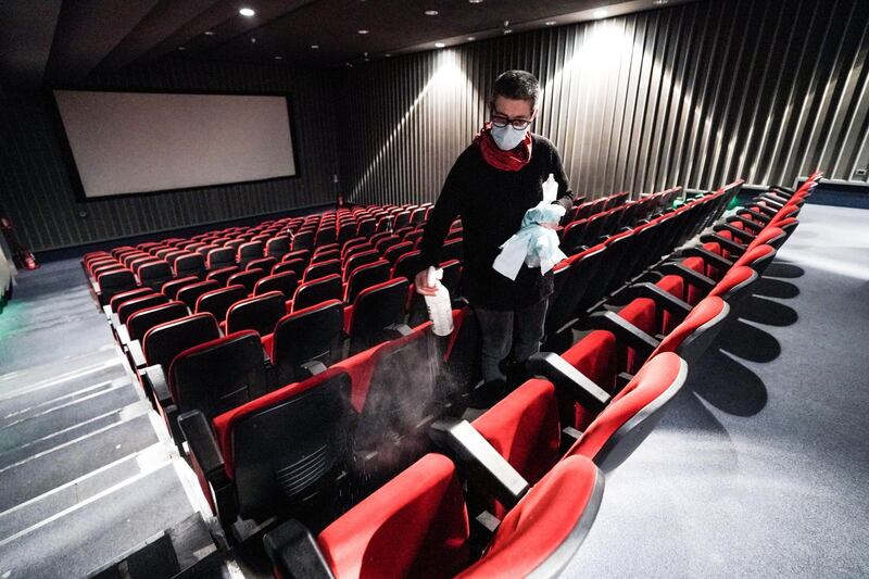 Staff disinfects a theater as the Ambrosio multiplex cinema as it reopens after a long period of closure due to the coronavirus pandemic, in Turin, Italy. EPA