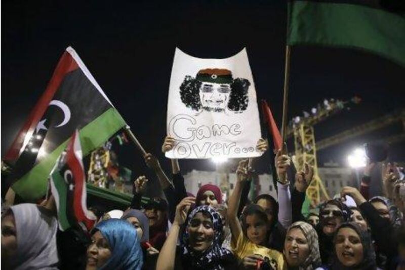 Women celebrate the uprising against Muammar Qaddafi's regime in Tripoli.