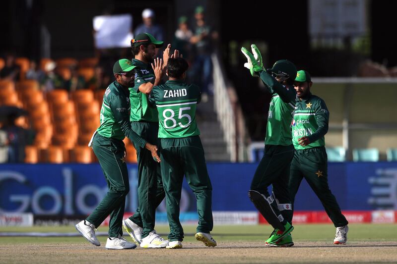Pakistani players celebrate after taking the wicket of Australia's Travis Head. EPA 