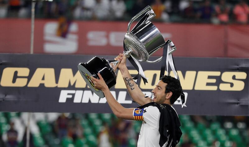 Valencia captain Daniel Parejo with the trophy. EPA