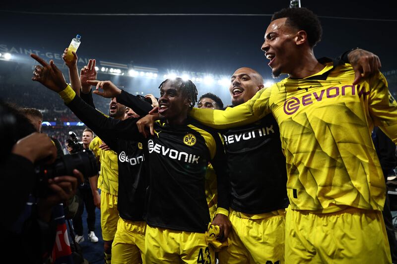 Dortmund players celebrate victory at the end of the Uefa Champions League semi-final against PSG. AFP