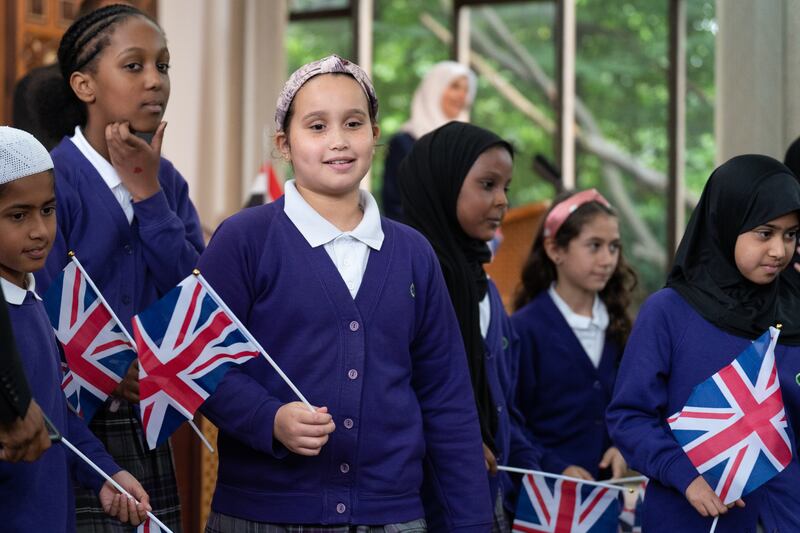 Schoolchildren from London attend the memorial at London Central Mosque. PA