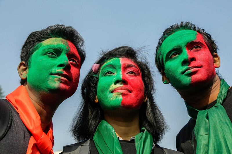Bangladeshi people with their faces painted with the colours of the national flag attend a rally during Victory Day celebrations in Dhaka, Bangladesh. Abir Abdullah / EPA