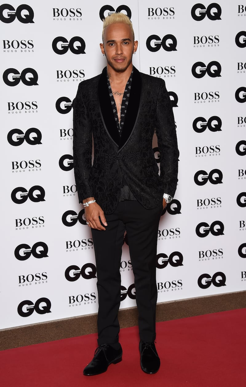 Lewis Hamilton, in a black Dolce & Gabbana brocade tuxedo, attends the GQ Men of the Year awards at The Royal Opera House on September 8, 2015, in London. Getty Images