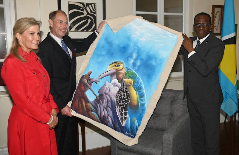 Sophie, Countess of Wessex, Prince Edward, Earl of Wessex and Philip Pierre, Prime Minister of Saint Lucia, exchange gifts during a reception on day one of their platinum jubilee royal tour of the Caribbean. Getty