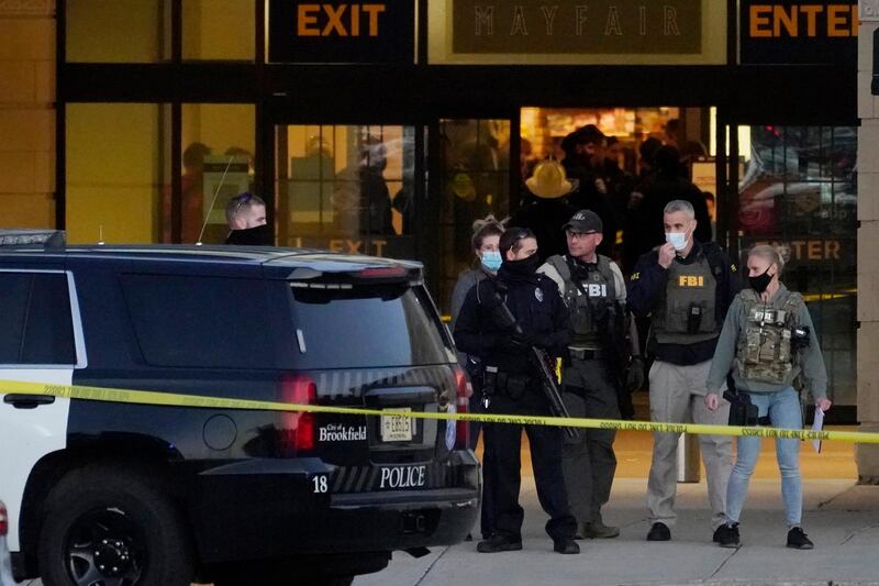 FBI officials and police stand outside the Mayfair Mall after a shooting in Wauwatosa, Wisconsin. Multiple people were shot Friday afternoon at the mall. AP