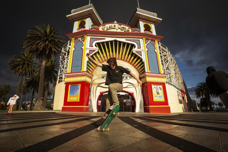 People ride skateboards and scooters in St Kilda, in Melbourne, Victoria, Australia. EPA