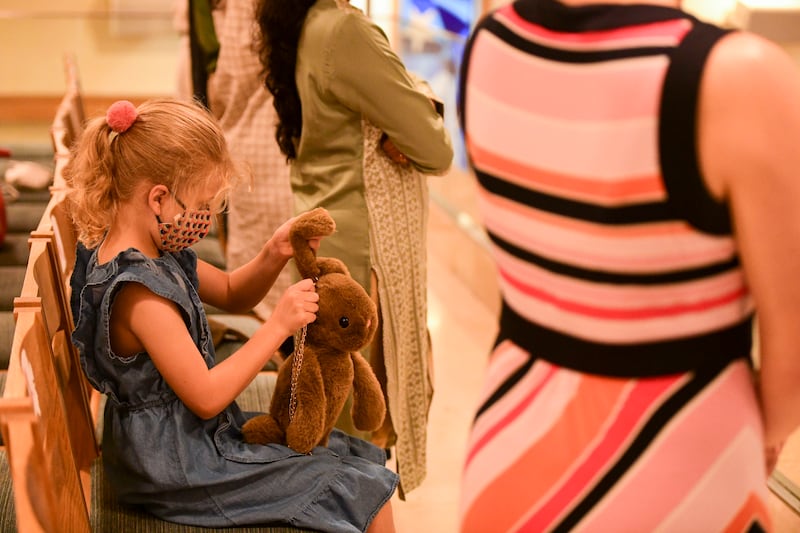 A young girl plays with her soft toy at St Andrew's Abu Dhabi. Khushnum Bhandari / The National
