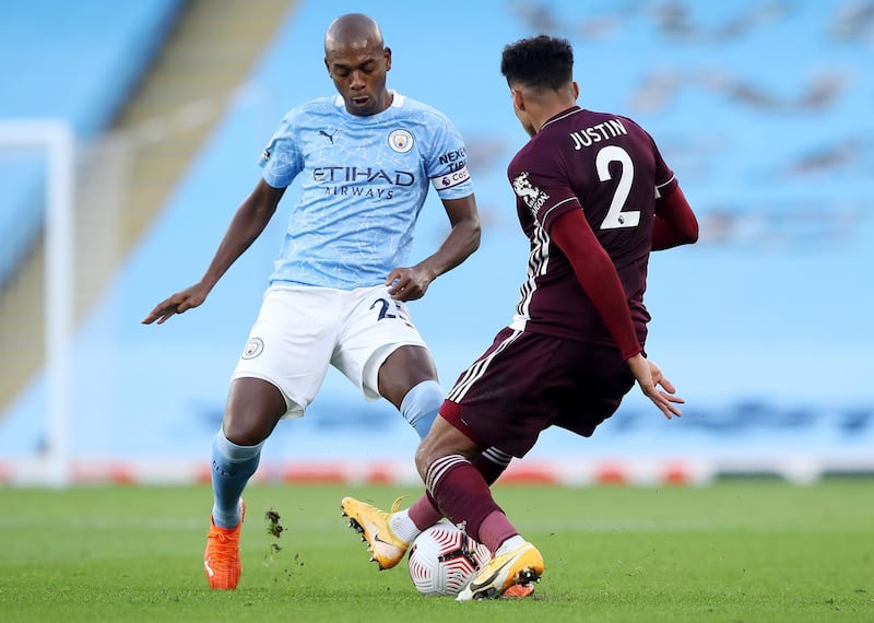 Fernandinho, left, of Manchester City in action against James Justin of Leicester. EPA