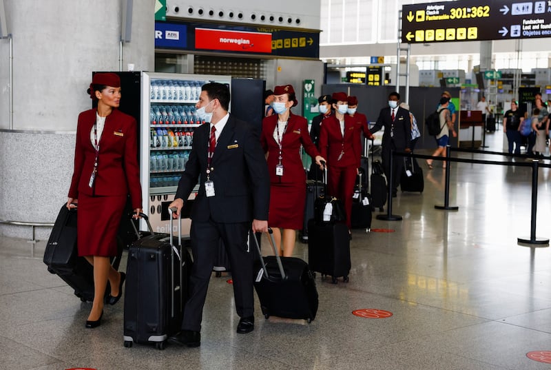 Qatar Airways crew walk through Malaga-Costa del Sol Airport, southern Spain. Reuters
