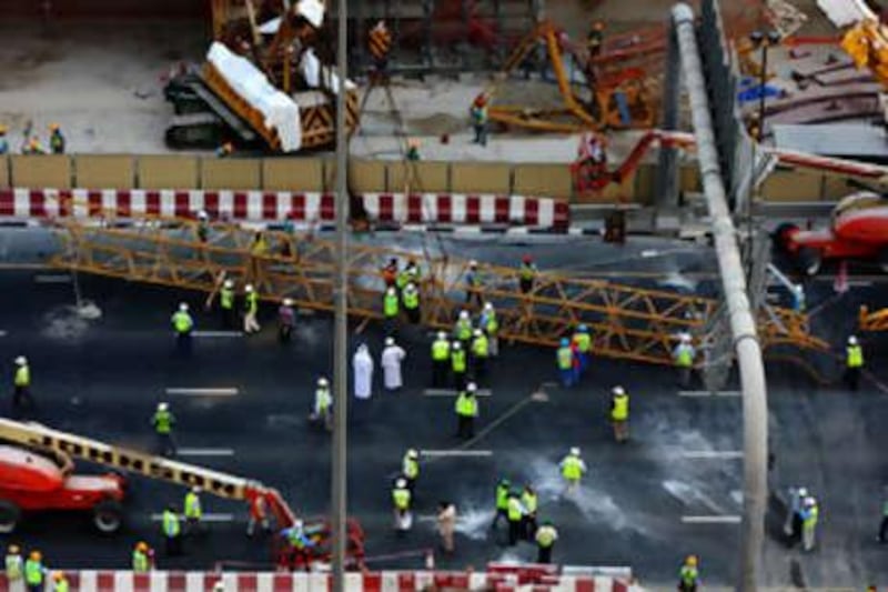 A crane working on the Dubai Metro track, near Emirates Tower fell onto scaffolding causing parts of Sheikh Zayed Road to be closed.
