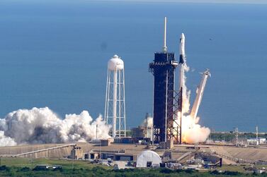 A SpaceX Falcon 9 rocket on a resupply mission to the International Space Station lifts off from pad 39A at the Kennedy Space Center in Cape Canaveral, Fla., Sunday, Dec. 6, 2020. (AP Photo/John Raoux)