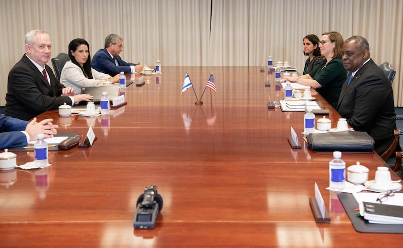 Mr Austin holds talks with the Israeli delegation led by Mr Gantz. AFP